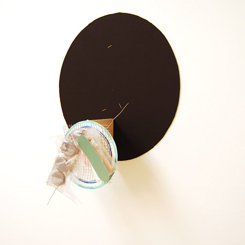 Richard Tuttle / Craft #14  2008 46 x 36 x 14 cm wiremesh, wire, cardboard, plastic and wood painted with silver-enemal paint mounted with a nail on painted cardboard circle on wood on black cardboard circle